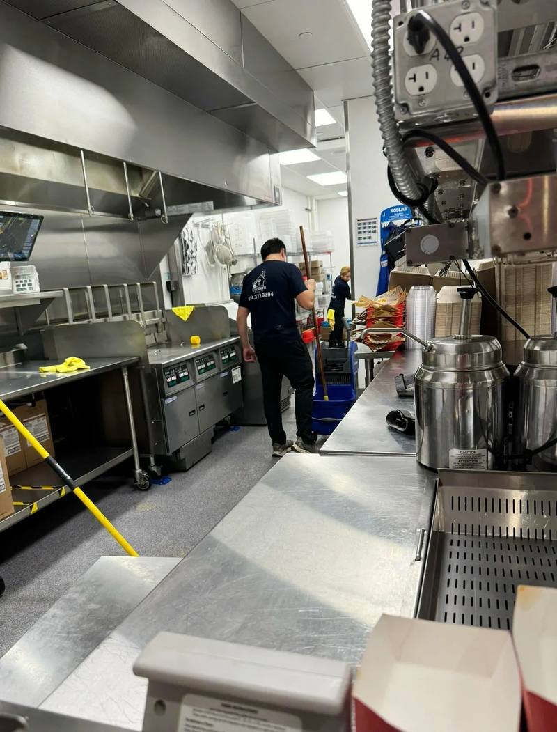 Mopping a restaurant fry line